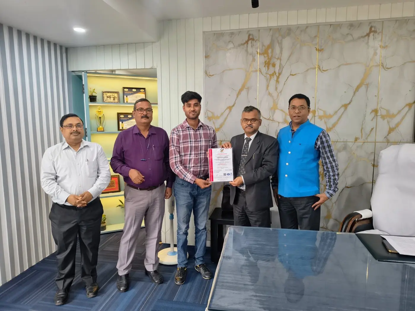 Certificate handover ceremony with QualityNexus consultant and client team